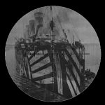 Olympic in her wartime service is seen through a periscope lens.